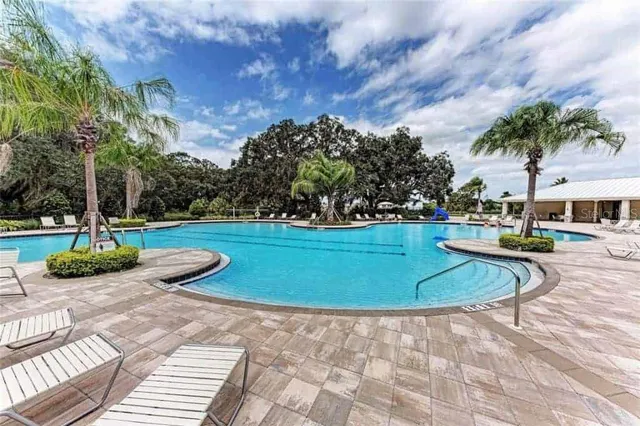 a view of a swimming pool with a yard