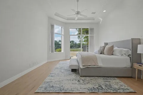 a living room with a bed furniture and a window