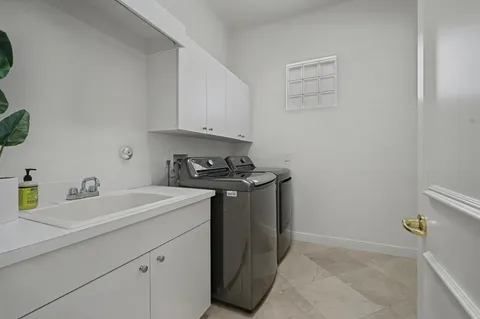 a kitchen with a sink and cabinets