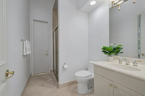 a bathroom with a toilet sink and shower