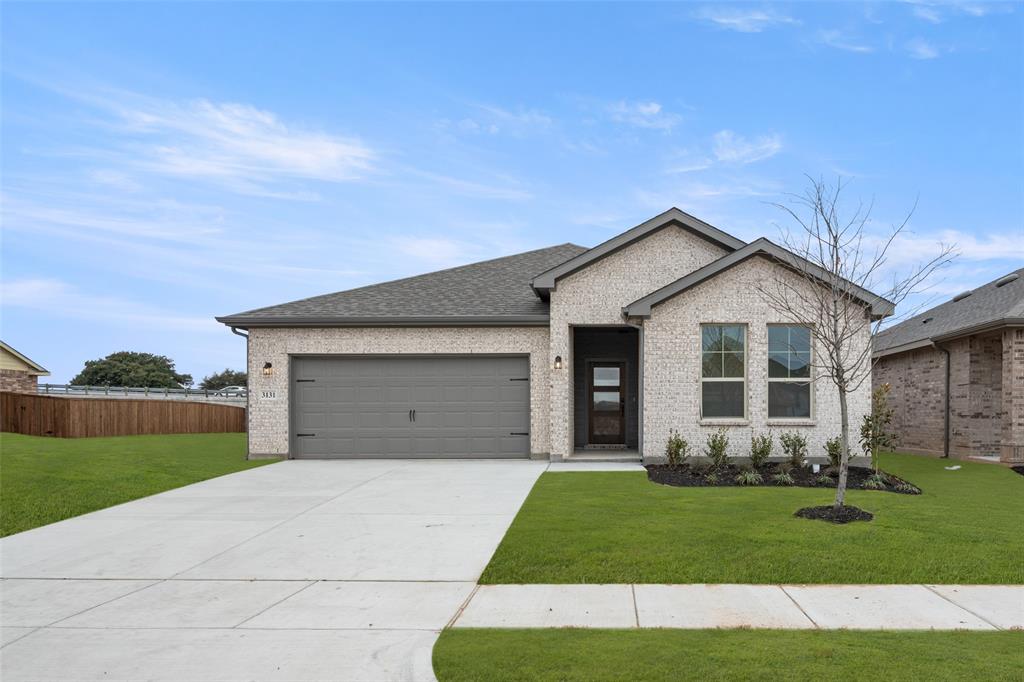 3131 Manchester Drive Cleburne, TX 76031 - Photo 1 of 1 a front view of a house with a yard and garage