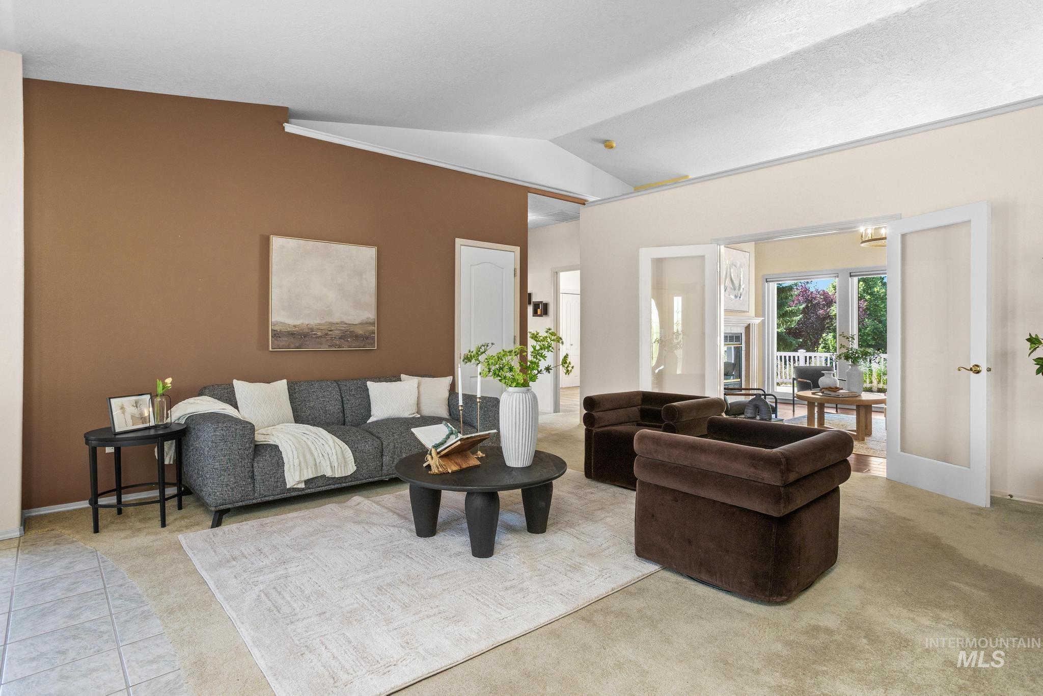 15181 Drury Way Caldwell, ID 83607 - Photo 5 of 49 Vaulted ceilings enhance this living space featuring a warm accent wall