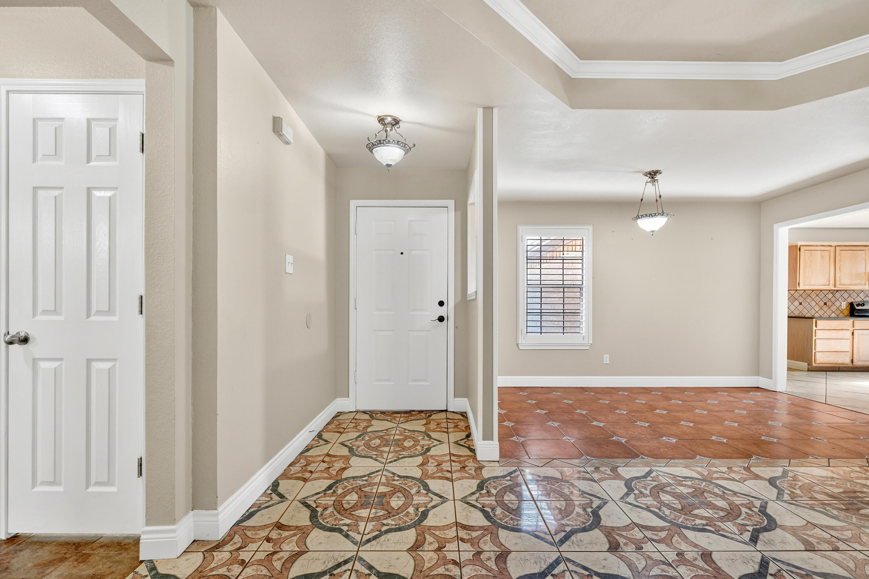 2415 93rd Street Lubbock, TX 79423 - Photo 3 of 24 a view of livingroom with hardwood floor and a ceiling fan