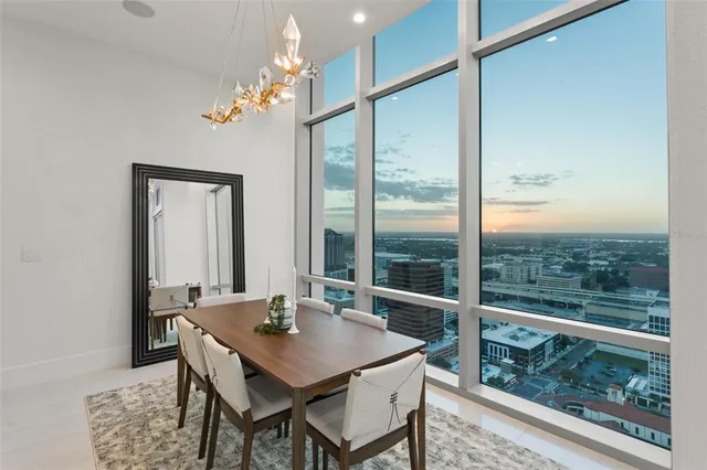 a view of a dining room with furniture window and outside view