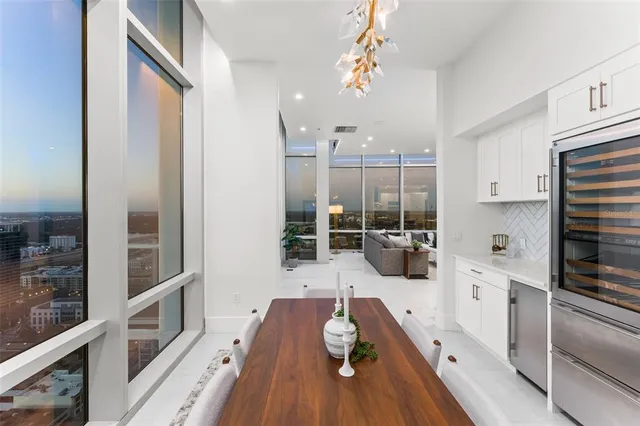 a kitchen with counter top space a stove a refrigerator and cabinets