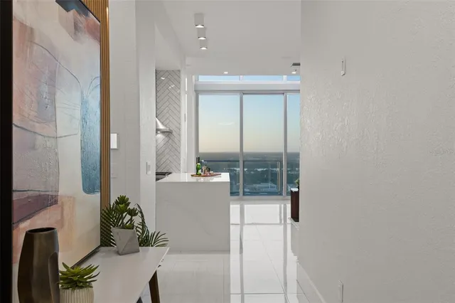 view of living room with furniture and floor to ceiling window