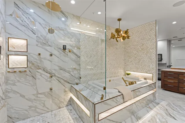 a spacious bathroom with a double vanity sink a large mirror and shower