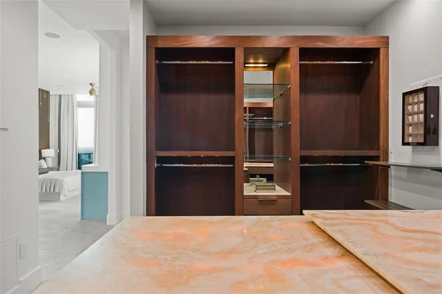 a bedroom with a bed and a mirror