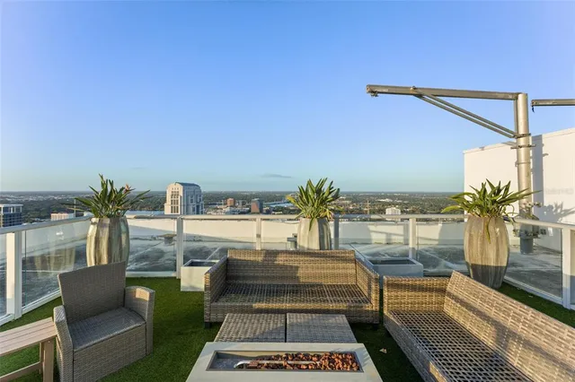 a view of a balcony with lake view and a floor to ceiling window