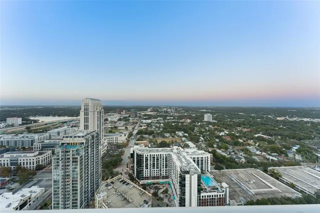 a swimming pool with outdoor seating and yard