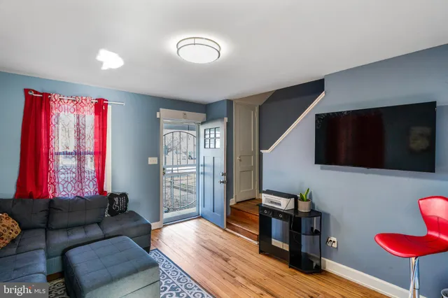a living room with furniture and a flat screen tv