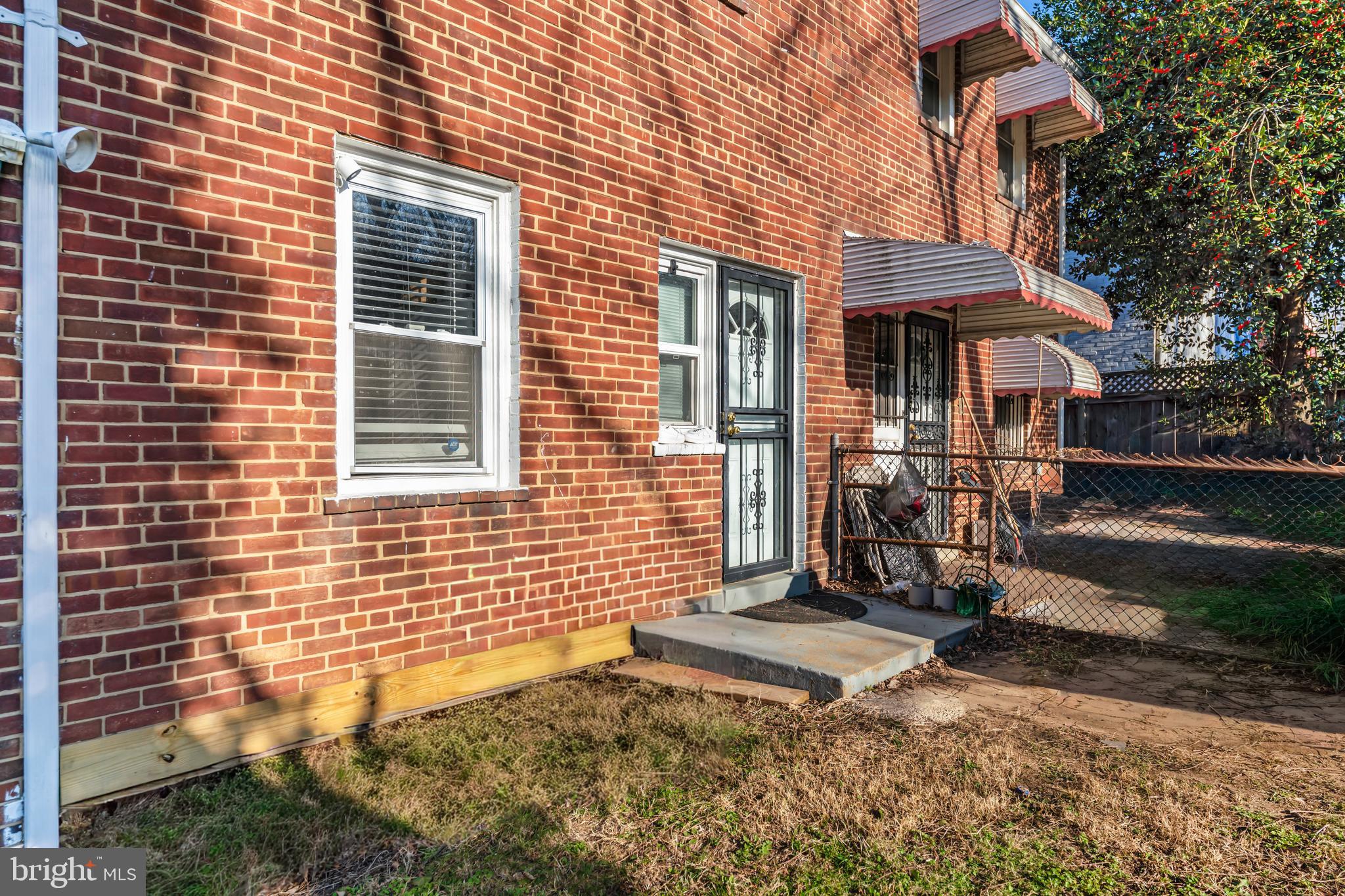 4801 B Street Southeast Washington, DC 20019 - Photo 38 of 43 a view of a brick house with many windows