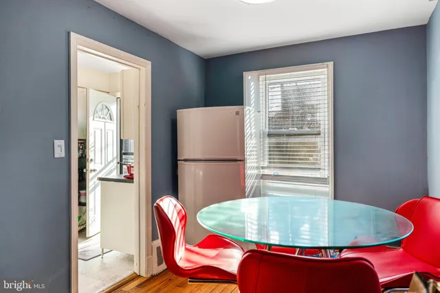 a dining room with a table and chairs