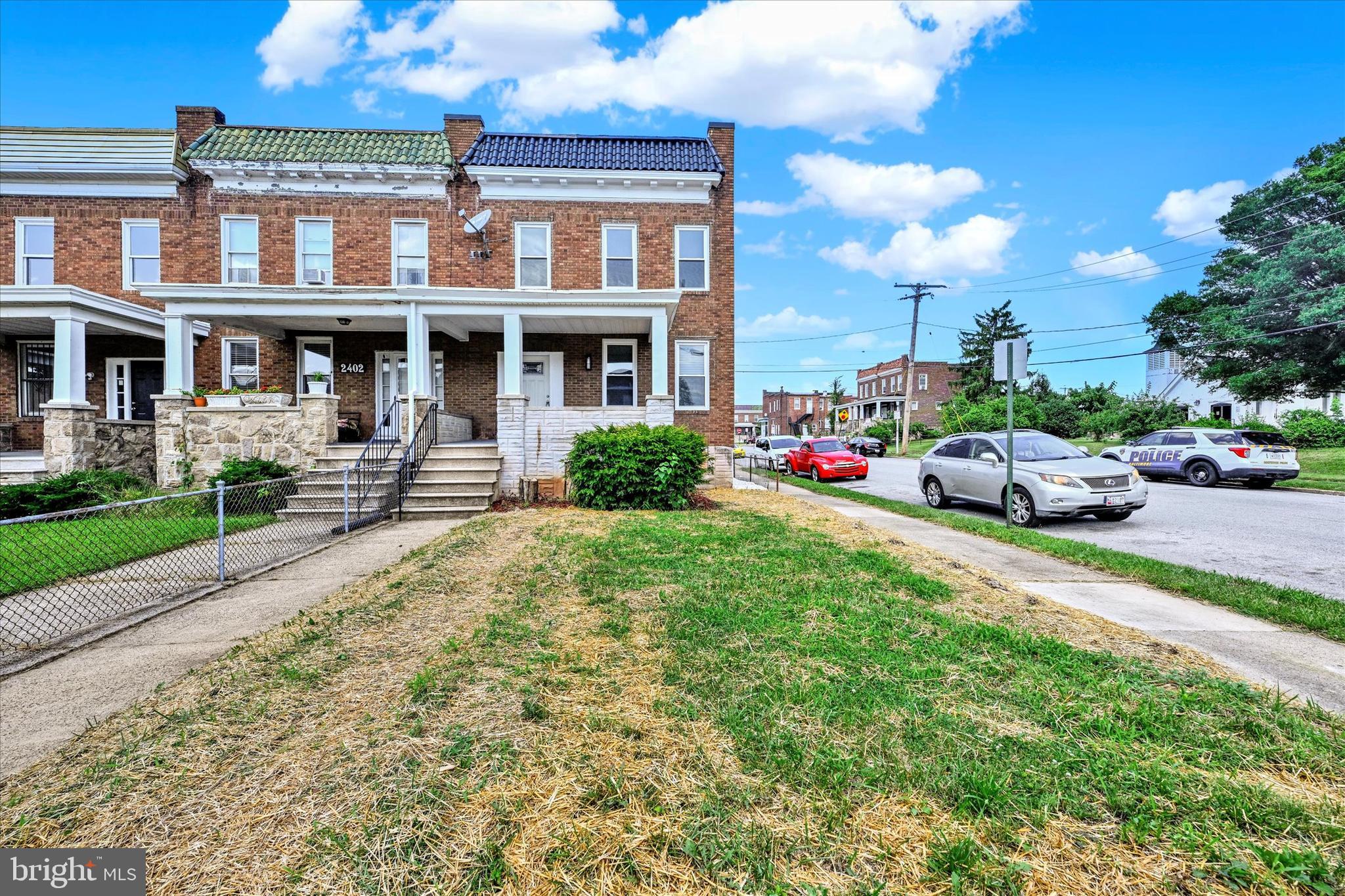 a front view of a building with garden