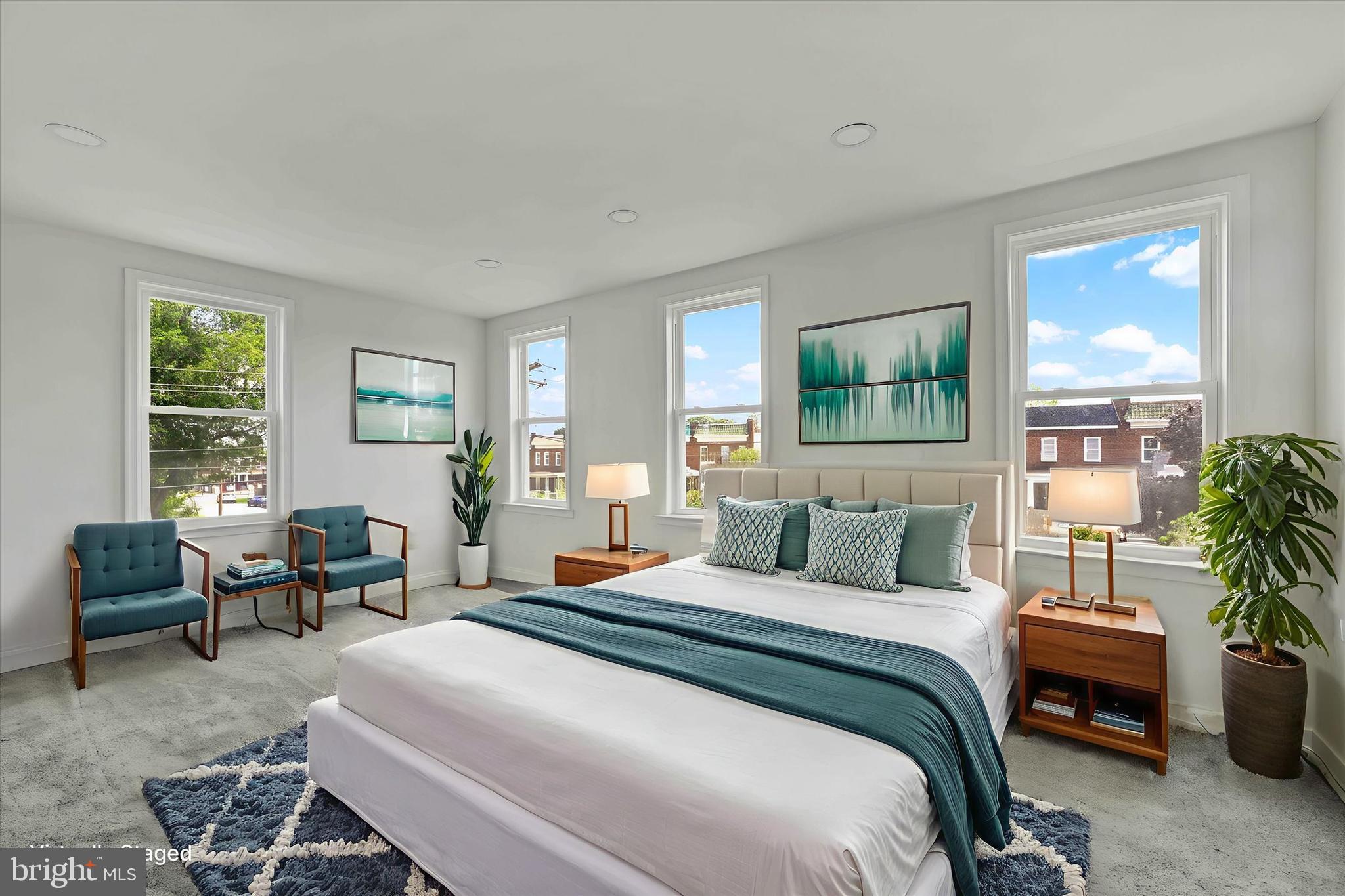 2400 West Lafayette Avenue Baltimore, MD 21216 - Photo 16 of 33 a bedroom with a large bed and windows