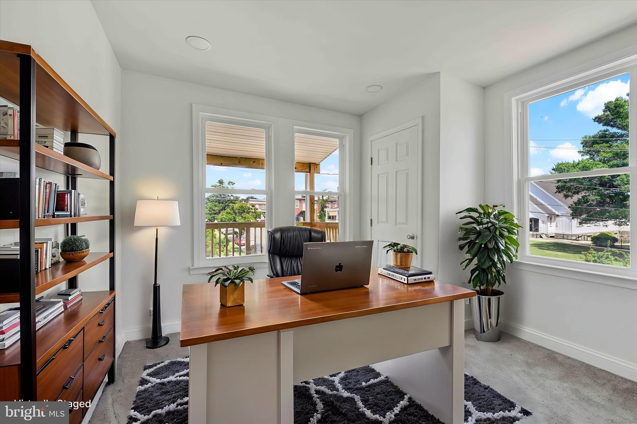 2400 West Lafayette Avenue Baltimore, MD 21216 - Photo 20 of 33 a work room with furniture and a potted plant