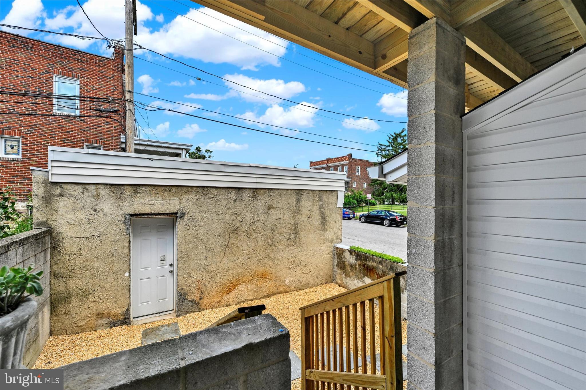 2400 West Lafayette Avenue Baltimore, MD 21216 - Photo 30 of 33 a view of a balcony with a potted plant