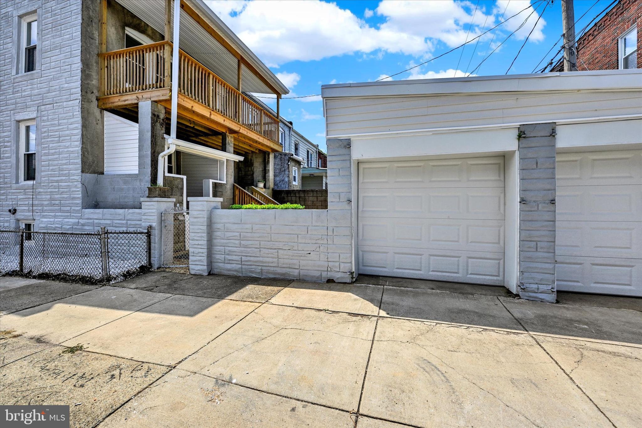 2400 West Lafayette Avenue Baltimore, MD 21216 - Photo 32 of 33 a view of a brick house with many windows