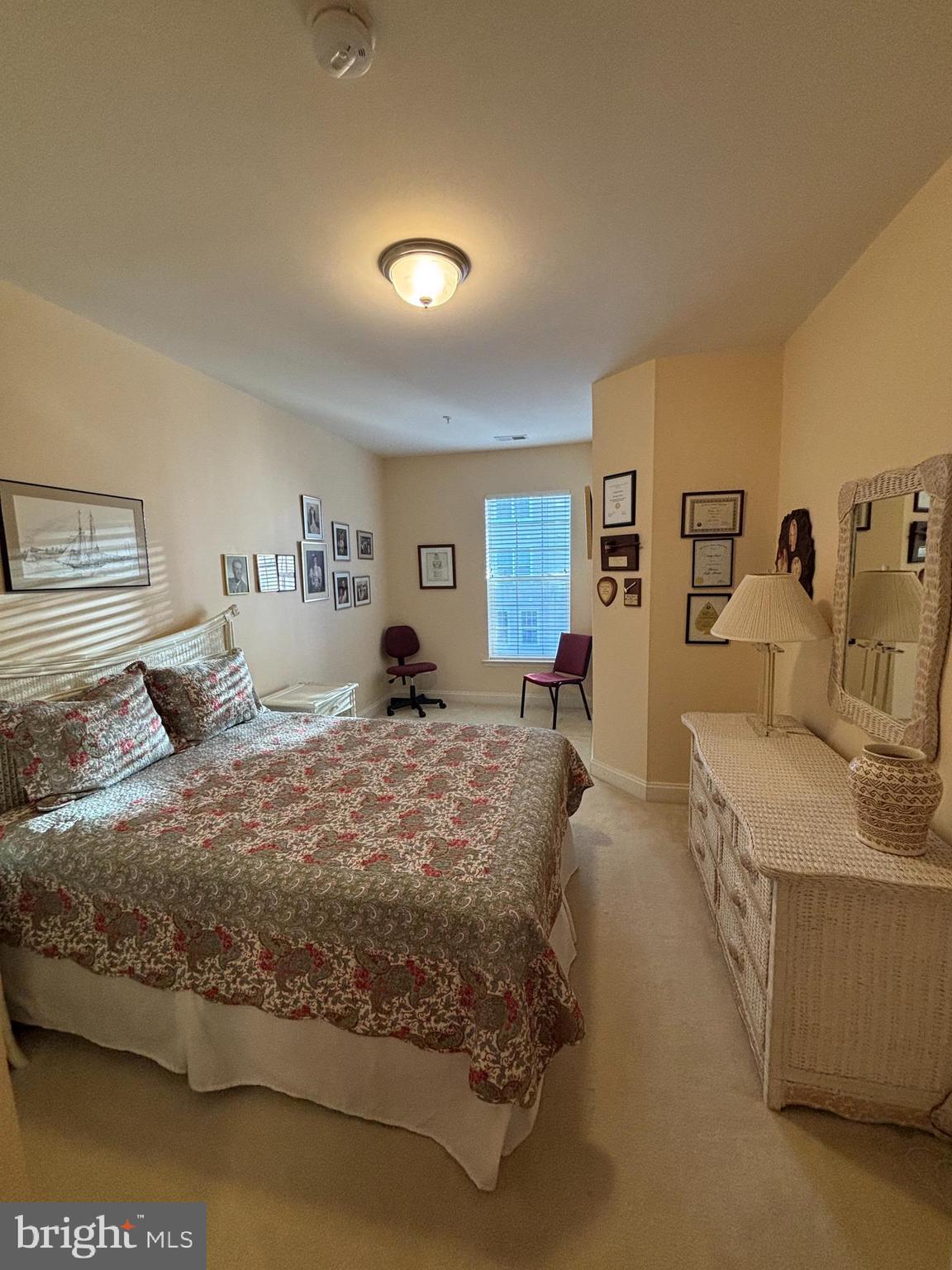 7300 Travertine Drive, Unit 302 Baltimore, MD 21209 - Photo 14 of 19 a large bedroom with a large bed and a couch