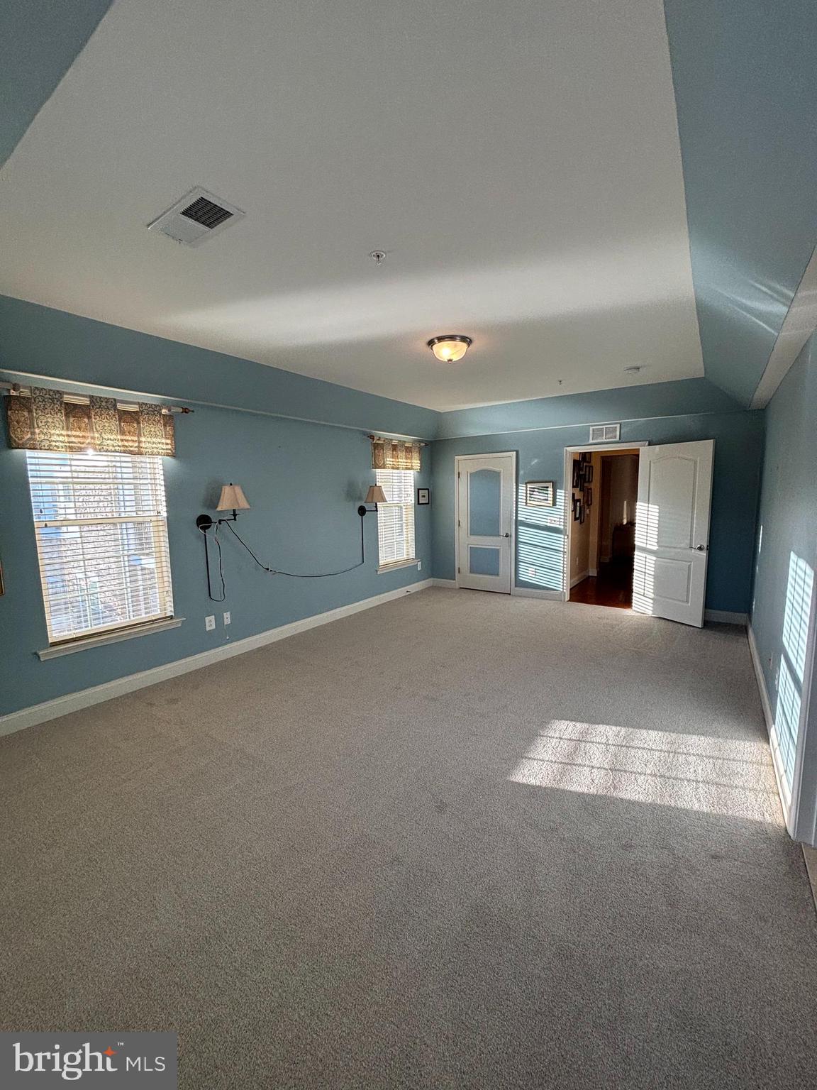 7300 Travertine Drive, Unit 302 Baltimore, MD 21209 - Photo 10 of 19 a view of a livingroom with wooden floor and a fireplace