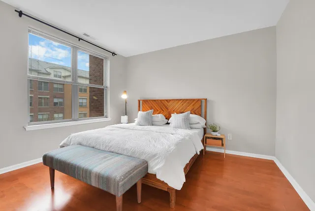 a bedroom with furniture and a window