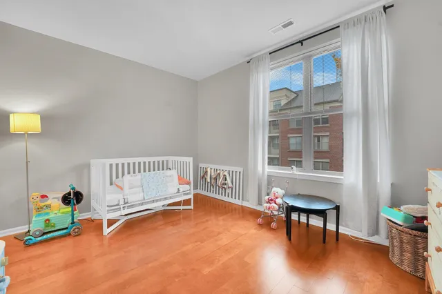 a bathroom with a toilet a sink and a mirror