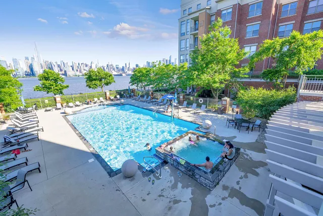 a picture of a bench in front of a white house