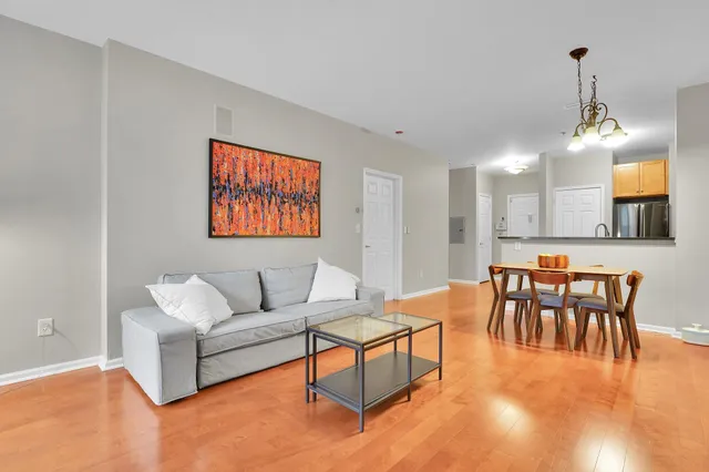 a kitchen with granite countertop a stove and a refrigerator