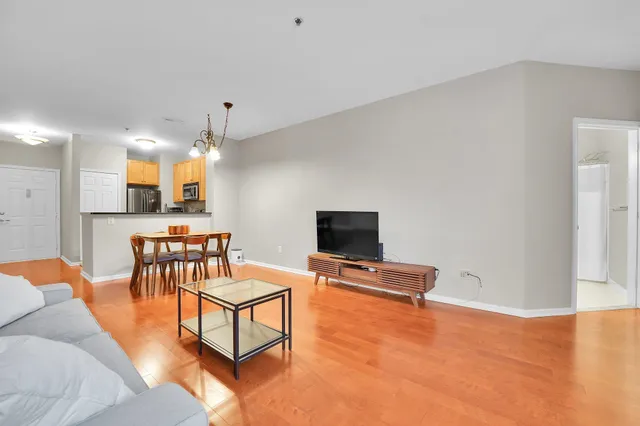 a bedroom with a bed and a lamp