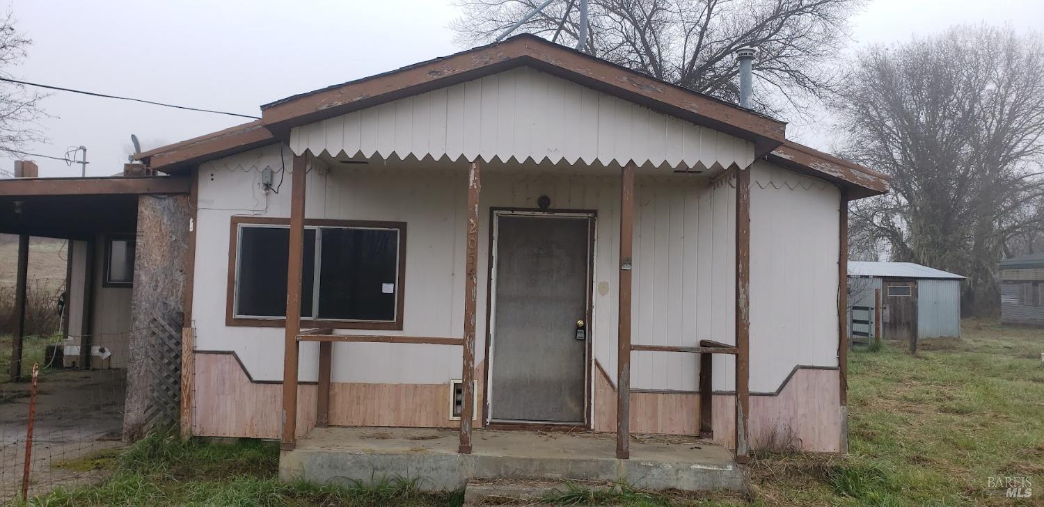 2054 Valley Road Willits, CA 95490 - Photo 1 of 1 a front view of a house with many windows