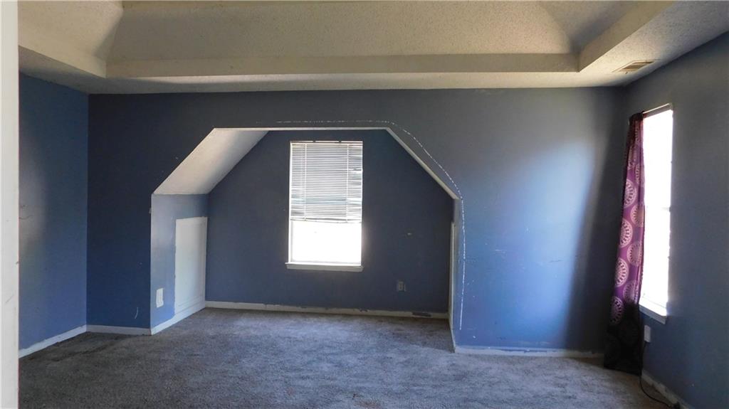 115 Windscape Drive Covington, GA 30016 - Photo 9 of 10 a view of empty room and window