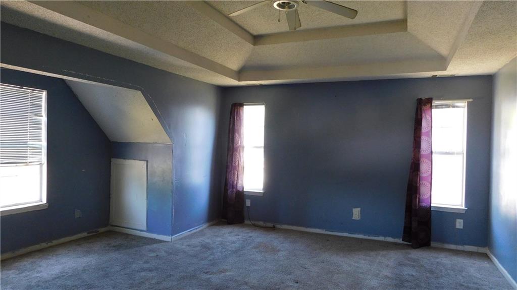 115 Windscape Drive Covington, GA 30016 - Photo 10 of 10 an empty room with windows and closet