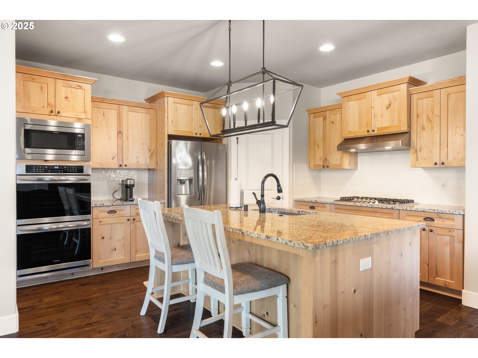 2344 Southeast 27th Street Battle Ground, WA 98604 - Photo 12 of 48 a kitchen with stainless steel appliances granite countertop a stove top oven a sink refrigerator and cabinets