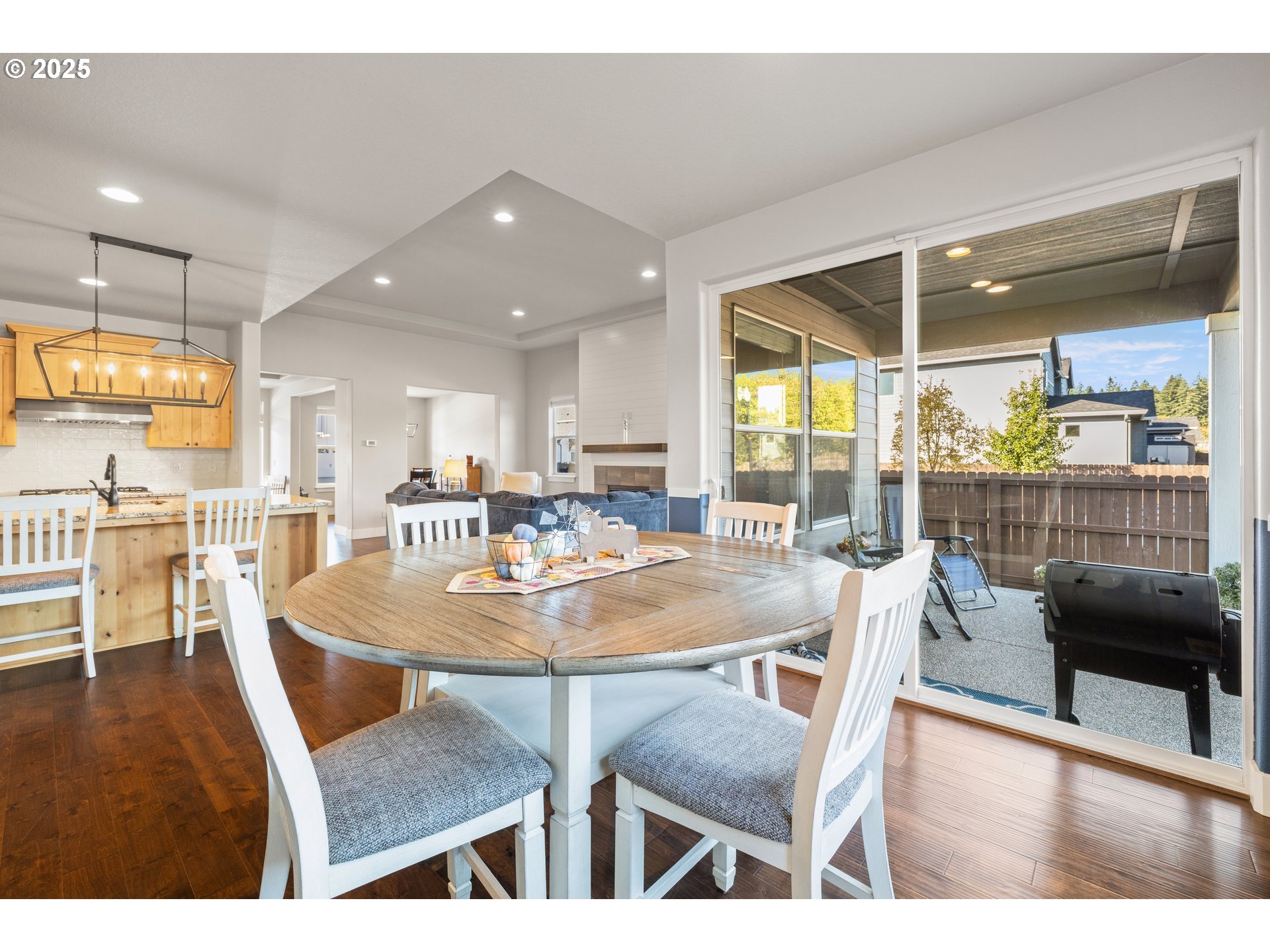 2344 Southeast 27th Street Battle Ground, WA 98604 - Photo 17 of 48 a view of a dining room with furniture wooden floor and a chandelier