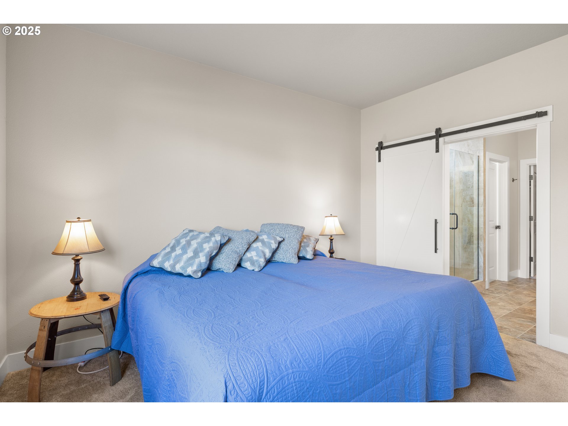 2344 Southeast 27th Street Battle Ground, WA 98604 - Photo 21 of 48 a bedroom with a bed and a lamp