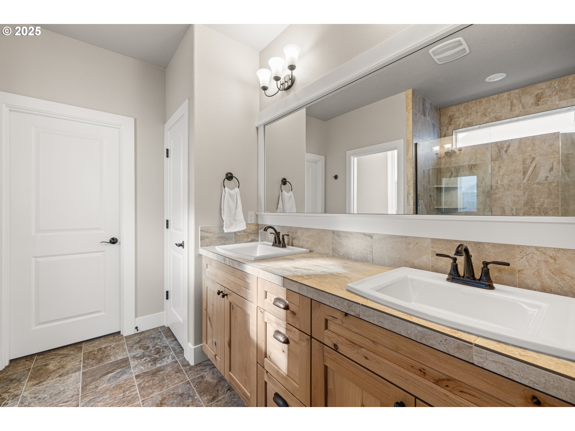 2344 Southeast 27th Street Battle Ground, WA 98604 - Photo 22 of 48 a bathroom with a sink and a mirror
