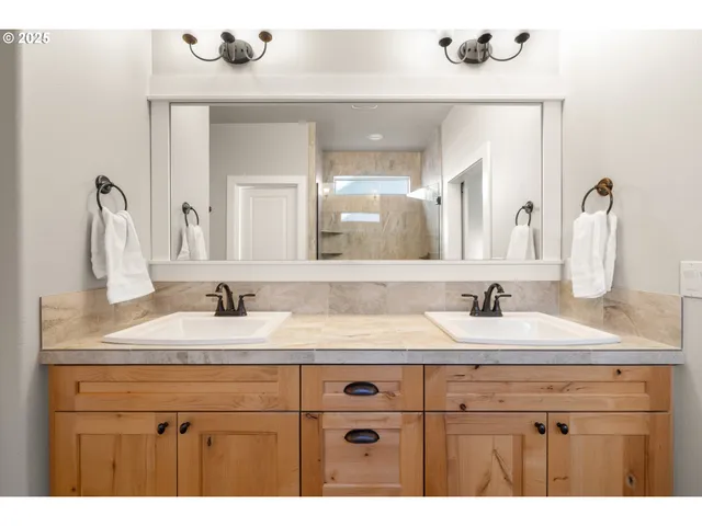 a bathroom with a sink vanity and a mirror