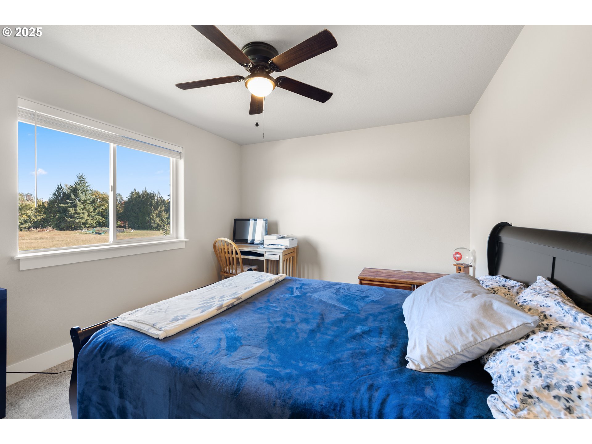 2344 Southeast 27th Street Battle Ground, WA 98604 - Photo 32 of 48 a bedroom with a bed and a window