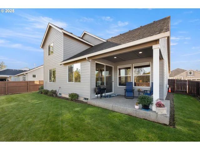 a view of a backyard with plants and a backyard