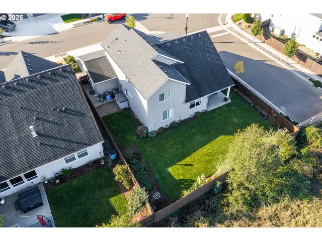 an aerial view of house with yard