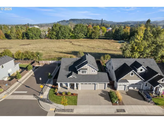 an aerial view of house with yard swimming pool and outdoor seating