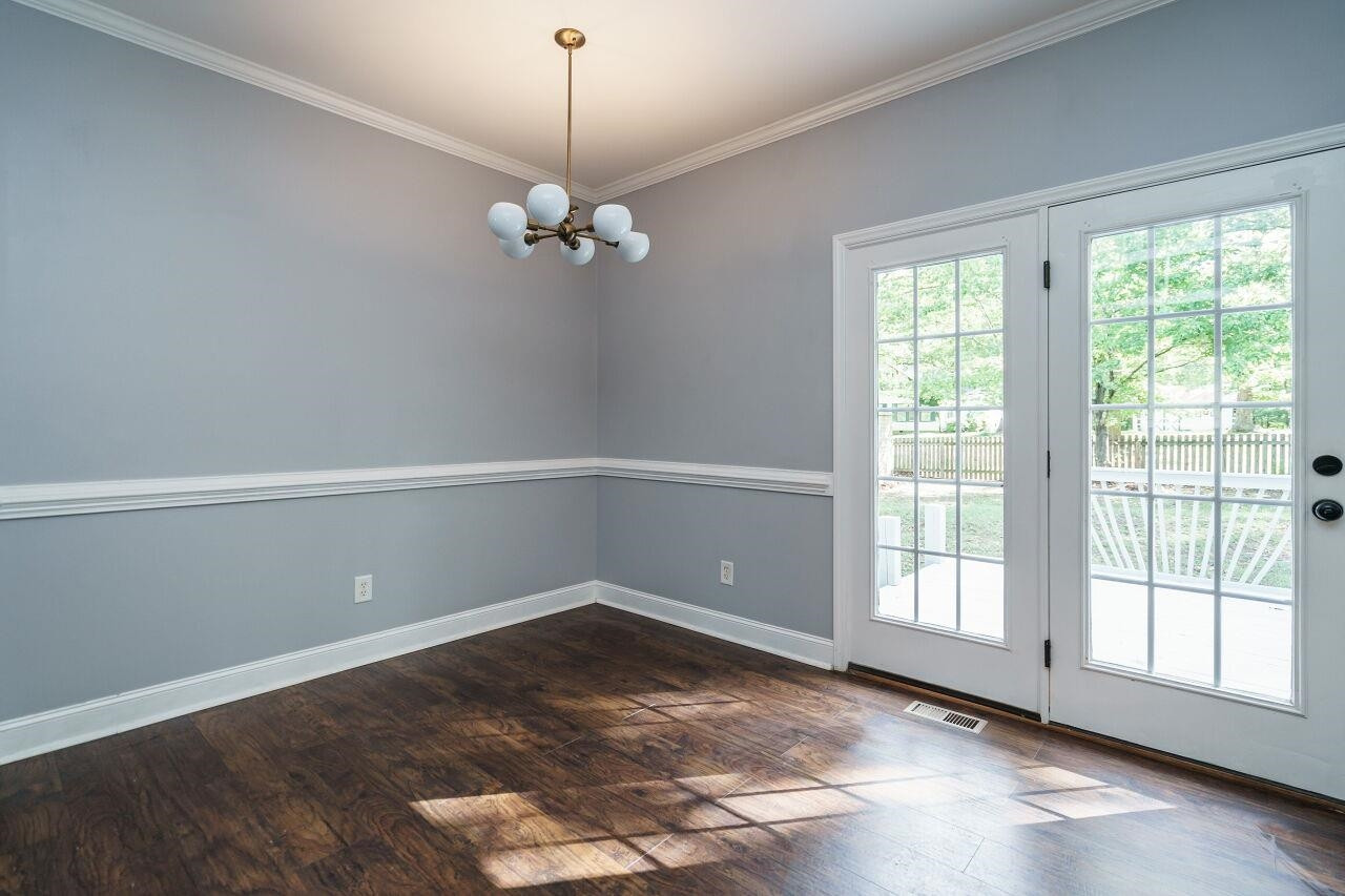 4202 Holt School Road Durham, NC 27704 - Photo 8 of 27 Bask in the beauty of every sunrise and relish the tranquility of your mornings in this charming sunny breakfast nook. Breakfast Nook