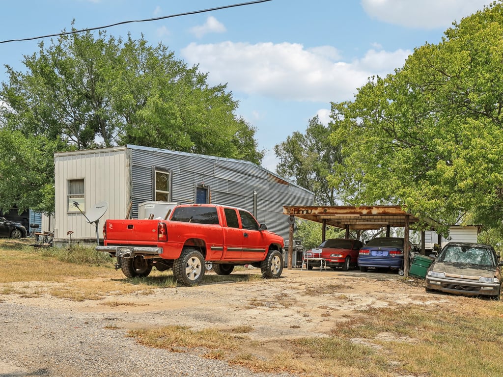 Tbd Tbd Bluebonnet Road Lockhart, TX 78644 - Photo 13 of 20 a car parked in front of a house