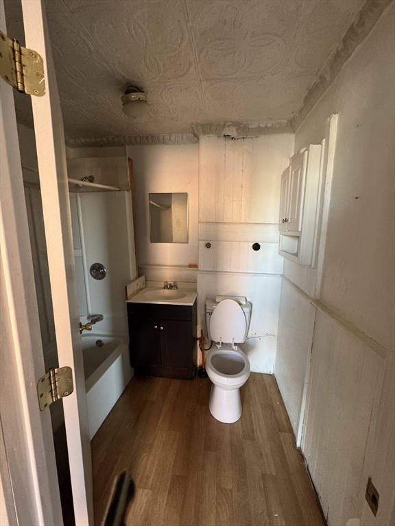 435-455 State Street Springfield, MA 01105 - Photo 7 of 13 a kitchen with wooden cabinets and white appliances