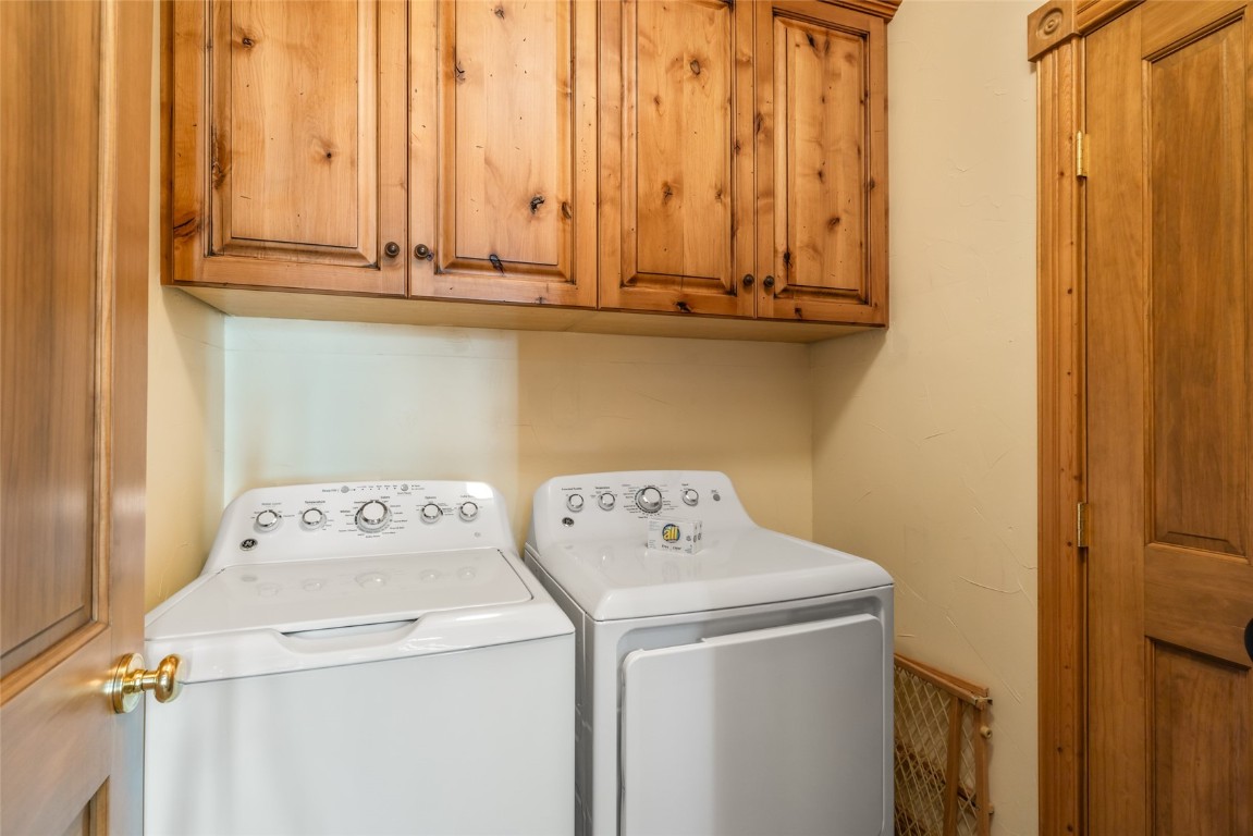2685 Timber Court, Unit 2 Steamboat Springs, CO 80487 - Photo 26 of 31 Clothes washing area with independent washer and dryer and cabinet space