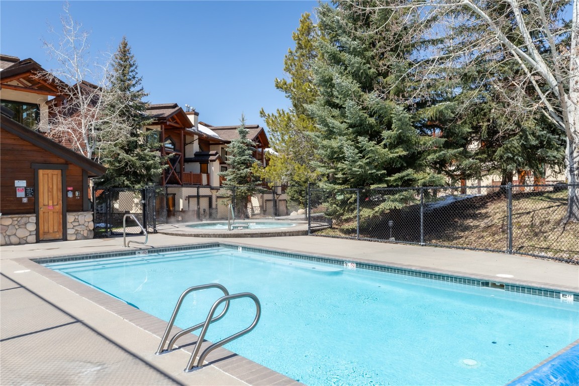 2685 Timber Court, Unit 2 Steamboat Springs, CO 80487 - Photo 29 of 31 Community pool featuring fence and a community hot tub