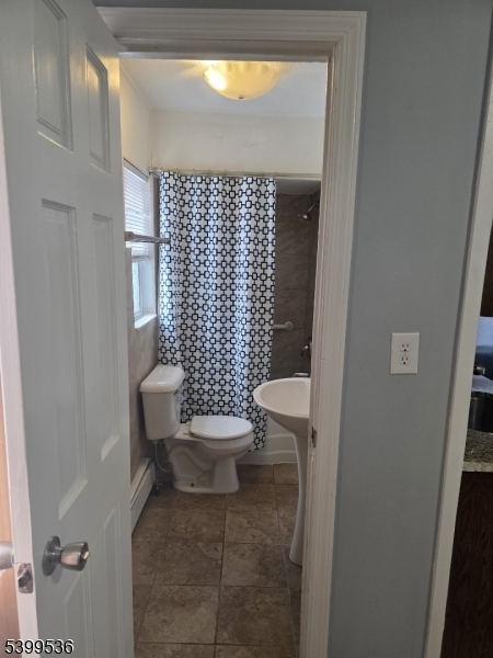 604 Freeman Street Lyndhurst, NJ 07071 - Photo 4 of 8 a bathroom with a toilet and a shower