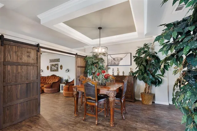 a living room with furniture a fireplace and a potted plant