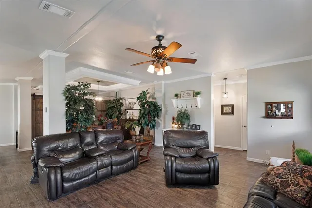 a view of a dining room kitchen with furniture and chandelier