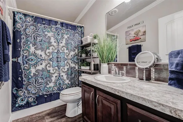 a bathroom with a sink double vanity and a mirror